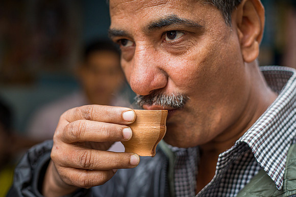 Man drinking chai